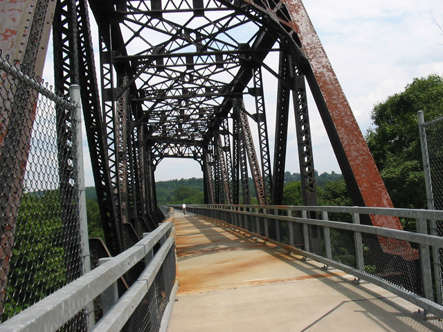 on bridge behind biker